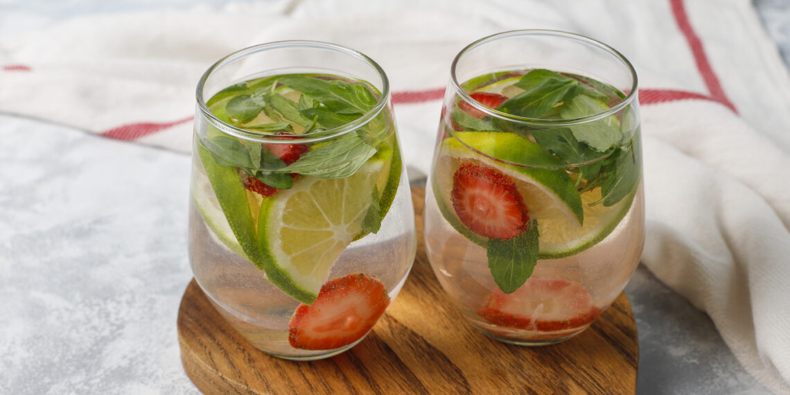fresh lime strawberry mint infused water cocktail detox drink lemonade summer drinks health care concept