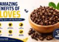 Wooden bowl filled with whole cloves showing the health benefits of cloves for digestion, immunity, antioxidants, and overall wellness.