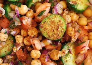 Healthy chana chaat with chickpeas, cucumber, tomatoes, red onion and fresh coriander