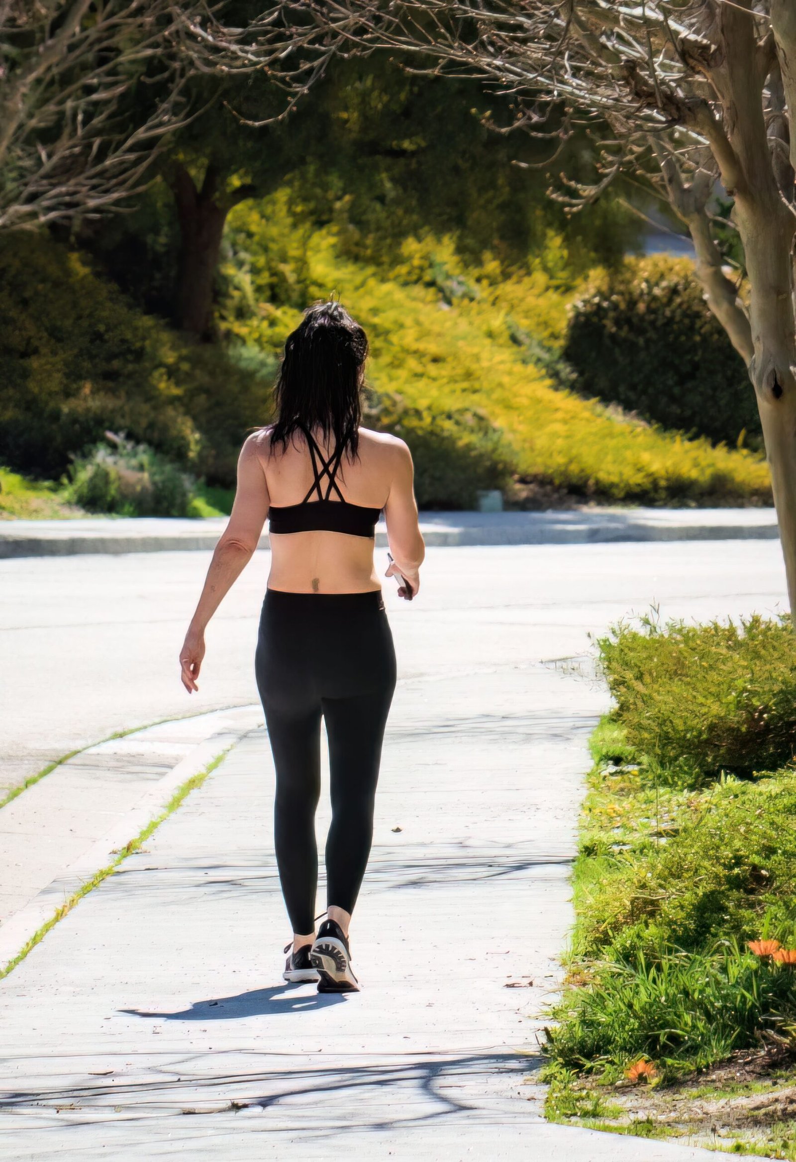 Woman walking outdoors for healthy weight loss